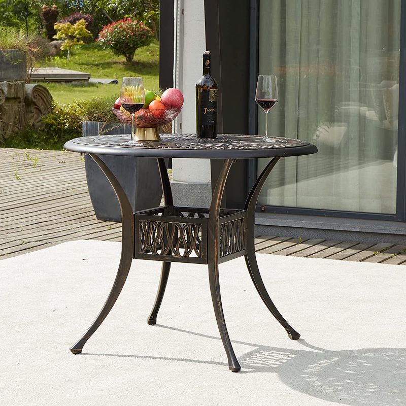 Photo 1 of AVAWING 32" Cast Aluminum Patio Bistro Table, Outdoor Round Dining Table w/ 2" Umbrella Hole
