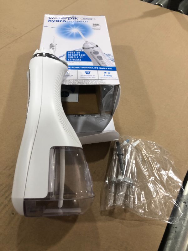 Photo 1 of Waterpik Cordless Advanced Water Flosser For Teeth, Gums, Braces, Dental Care With Travel Bag and 4 Tips, ADA Accepted, Rechargeable, Portable, and Waterproof, White WP-560