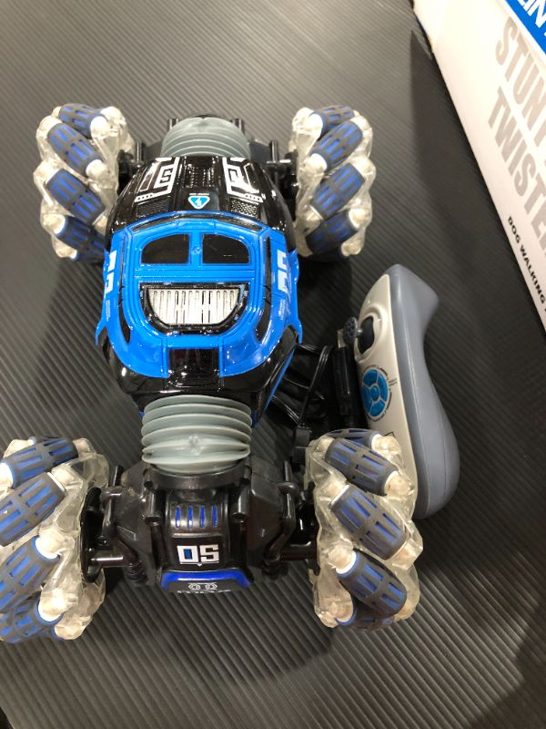 Photo 2 of Remote Control Car Hobby RC Crawlers 4WD Stunt Car Double Sided 360 Flips Colorful Lights and Music Electric High Speed Off Road Drift Vehicle 1:14 Scale Rechargeable Monster Truck for 8-12 Boys Girls
