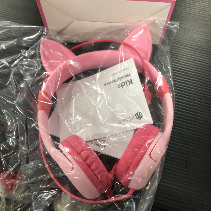 Photo 2 of 
Roll over image to zoom in
iClever HS01 Kids Headphones with Mic, Food Grade Safe Volume Limited 85/94dB, Cat Ear Headphones for Kids Girls Boys, Wired Children Headphones for Online Learning/School/Travel/Tablet (Pink)
