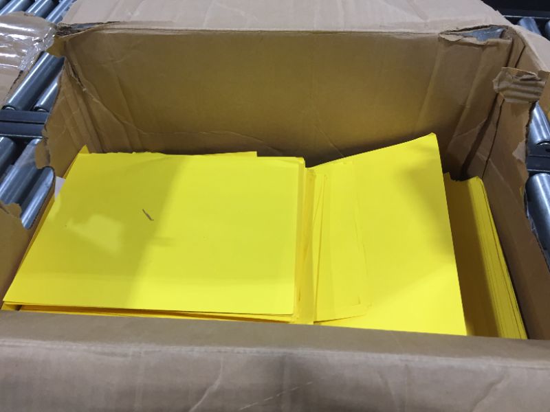 Photo 1 of BOX OF YELLOW CONSTRUCTION PAPER 