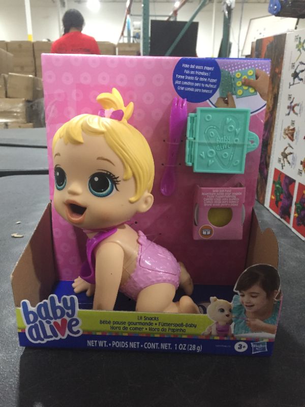 Photo 2 of Baby Alive Lil Snacks Doll with Blonde Hair, Eats and "Poops"
