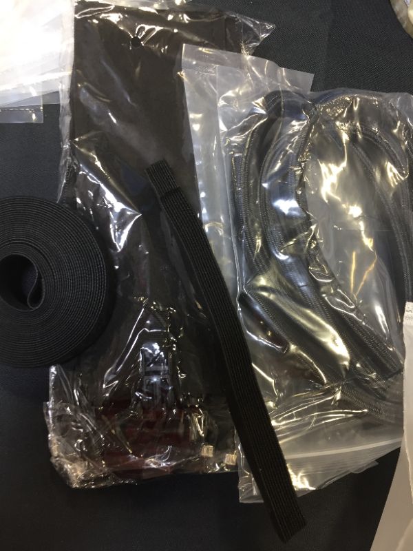 Photo 2 of 117 PCS Cable/Cord Management Kit, 5 x Cable Sleeve with Zipper, 1 x 1.5m Roll Cable Sleeve Cover, 10pcs and 1 x Roll Self Adhesive tie, 100 x Fastening Cable Ties for Home and Office
