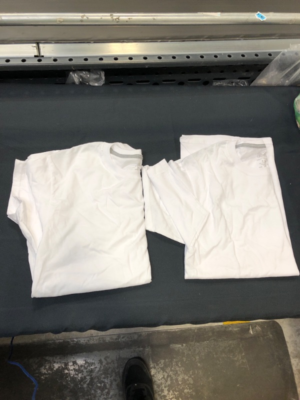 Photo 1 of 2 small white shirts