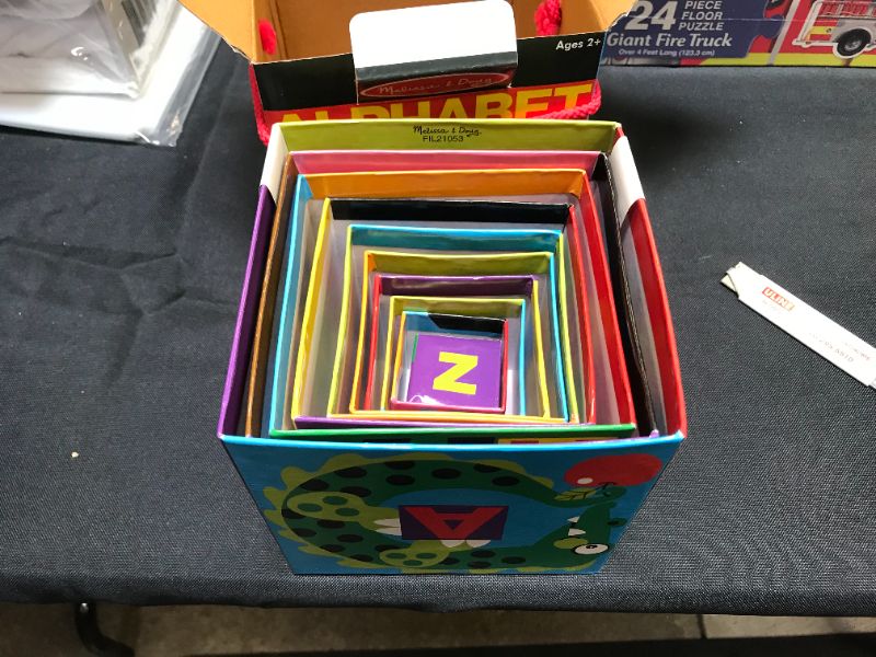 Photo 1 of Melissa & Doug Deluxe 10-Piece Alphabet Nesting and Stacking Blocks & 20 Wooden Animal Magnets in a Box
