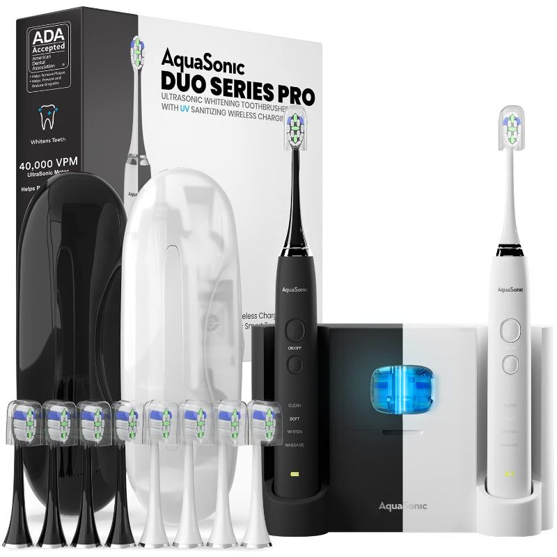 Photo 1 of AquaSonic DUO PRO – Ultra Whitening 40,000 VPM Electric Smart ToothBrushes – ADA Accepted - 4 Modes with Smart Timers - UV Sanitizing & Wireless Charging Base - 10 ProFlex Brush Heads & 2 Travel Cases
