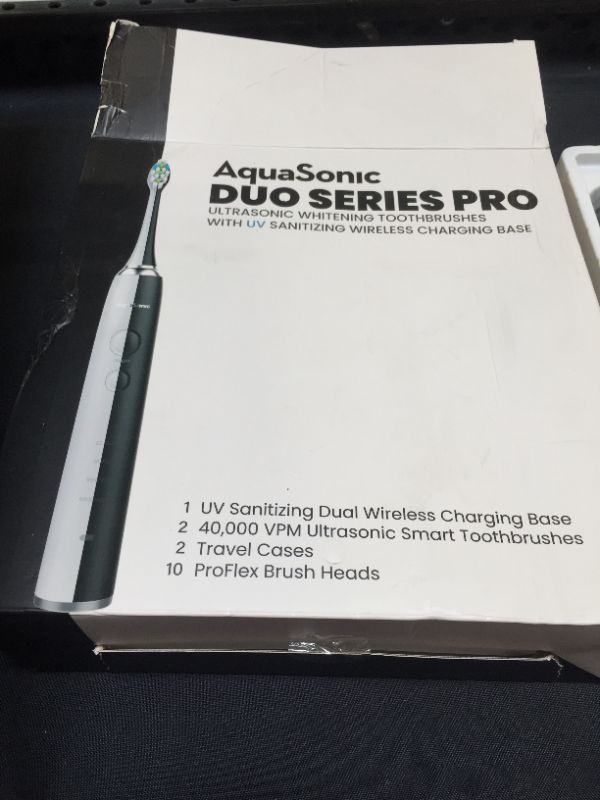 Photo 2 of AquaSonic DUO PRO – Ultra Whitening 40,000 VPM Electric Smart ToothBrushes – ADA Accepted - 4 Modes with Smart Timers - UV Sanitizing & Wireless Charging Base - 10 ProFlex Brush Heads & 2 Travel Cases
