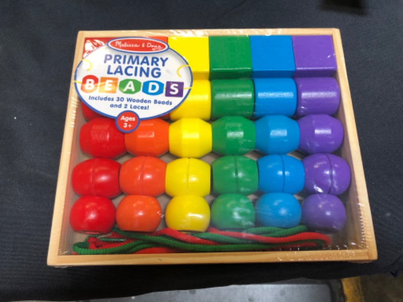 Photo 2 of Melissa & Doug Primary Lacing Beads - Educational Toy With 30 Wooden Beads and 2 Laces
