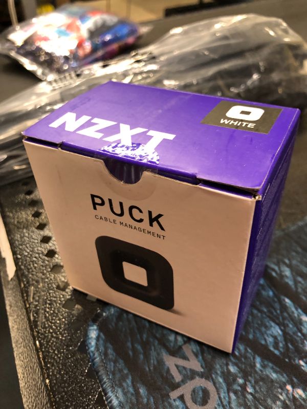 Photo 2 of NZXT Puck - BA-PUCKR-W1 - Cable Management and Headset Mount - Compact Size - Silicone Construction - Powerful Magnet for Computer Case Mounting - White
