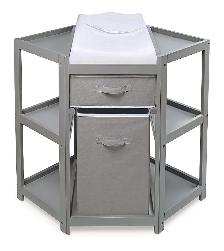 Photo 1 of Diaper Corner Baby Changing Table with Pad, Hamper and Basket. SMALL CUT ON BOTTOM FABRIC HAMPER.
