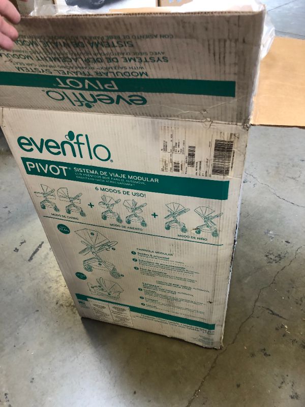 Photo 1 of Evenflo Pivot Modular Travel System with SafeMax Infant Car Seat

