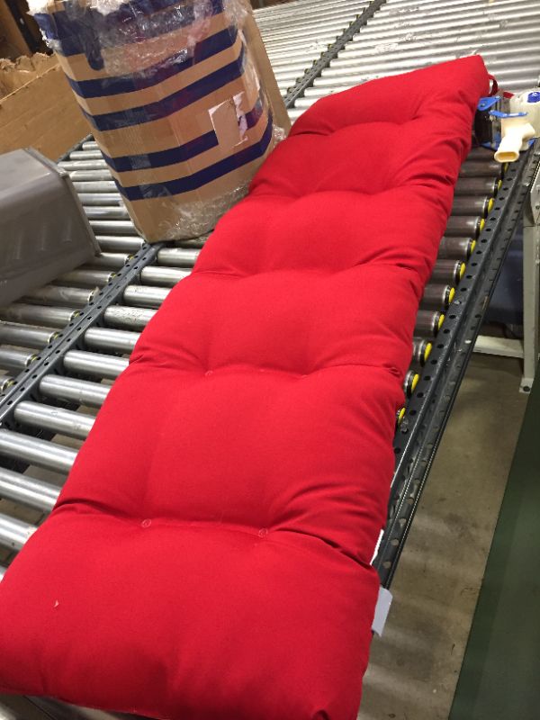 Photo 1 of 62 X 20 INCH CUSHION - RED - DAMAGE AS SHOWN/TEAR IN PRODUCT. DS