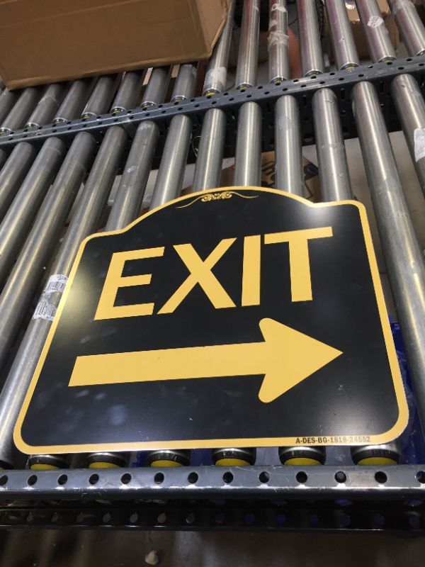 Photo 1 of 18X18" METAL BLACK AND YELLOW EXIT ARROW SIGN.