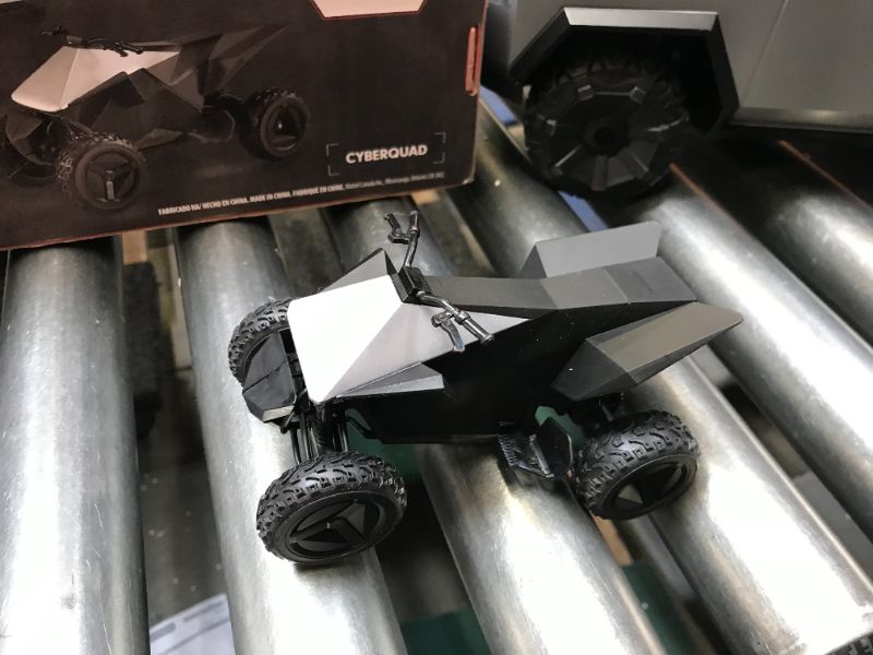 Photo 1 of Hot Wheels R/C 1:10 Tesla Cybertruck Radio-Controlled Truck & Electric Cyberquad, Custom Controller, Speeds to 12 MPH, Working Headlights & Taillights, for Kids & Collectors


