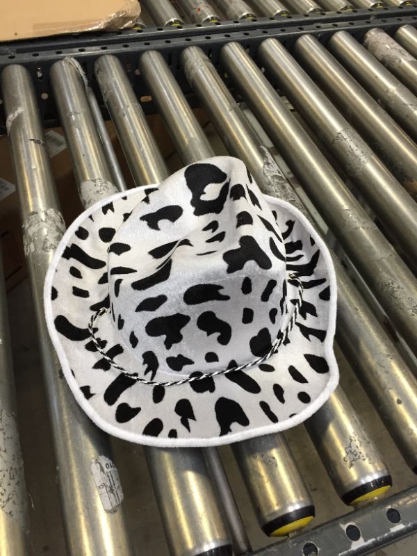 Photo 1 of SMALL WHITE AND BLACK SPOT COWBOY HAT. 