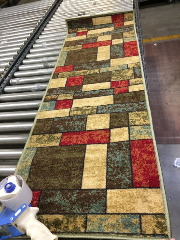 Photo 1 of 19X57 INCH RUNNER RUG. 