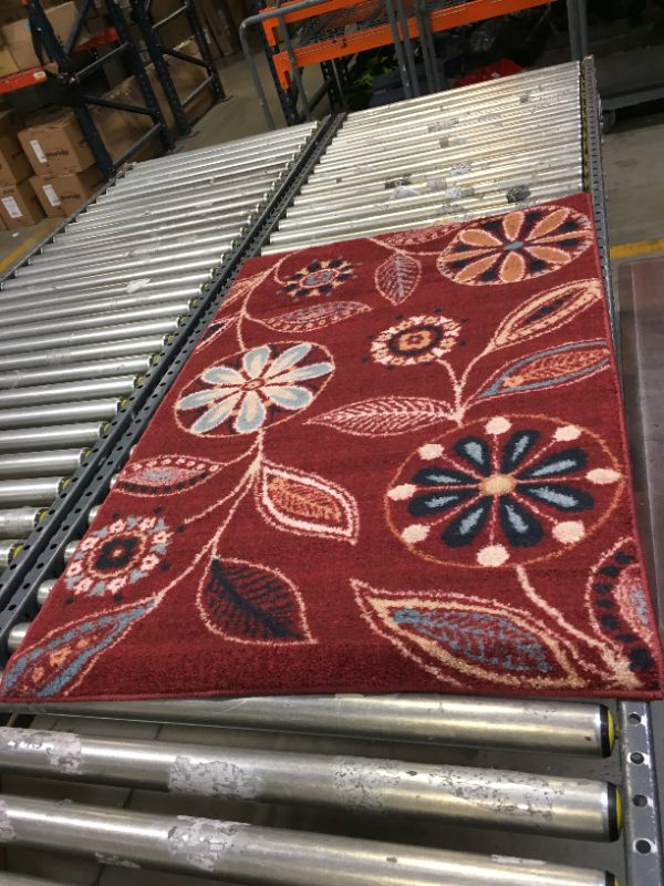 Photo 1 of 19X31 INCH RED FLOWER PATTERN RUG