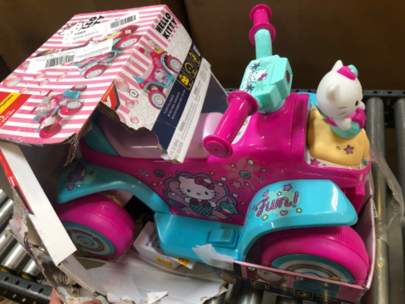 Photo 2 of Hello Kitty 6V Girls' Electric Ride-On Bubble Quad, Pink, by Huffy
