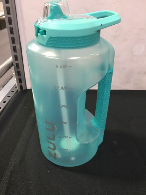 Photo 2 of ZULU Goals Large Half Gallon Jug Water Bottle with Motivational Time Marker, Covered Straw Spout and Carrying Handle, 64 Oz,Aquaviva
SCRATCHES ON ITEM 