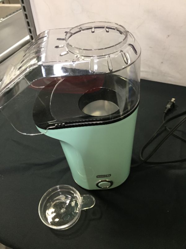 Photo 3 of Dash DAPP150GBAQ04 Dash Popcorn Machine, Aqua
(FOOD STAINS ON ITEM)