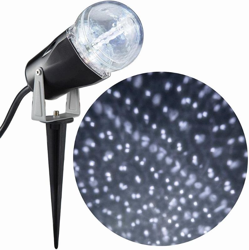 Photo 1 of Gemmy Lightshow LED Turning Swirling Star Spinner Light Show Projektion Spot mit Erdspieß, weiß, für Haus, Bäume, Garagentor, Strauch und mehr

