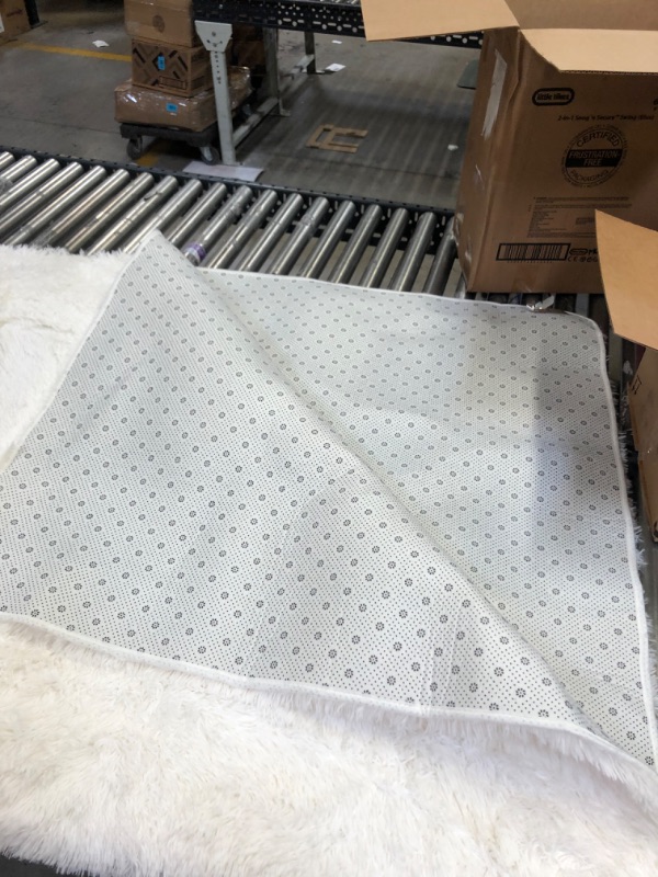Photo 1 of 8'x5' fuzzy white rug 