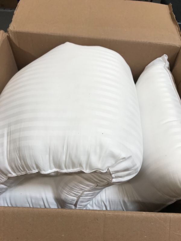 Photo 1 of box of standard size pillows 