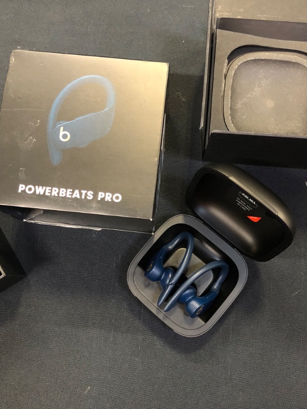 Photo 2 of Powerbeats Pro Wireless Earphones - Apple H1 Headphone Chip, Class 1 Bluetooth, 9 Hours of Listening Time, Sweat Resistant Earbuds, Built-in Microphone - Navy [ has bite marks on 1 ear bud / both earbuds are dirty and need to be cleaned ] power works and 