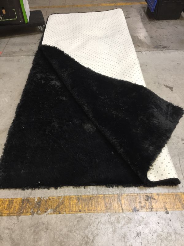 Photo 1 of Black Fluffy Rug
10'x8'