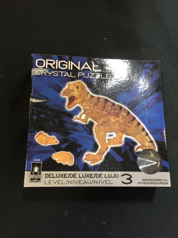 Photo 2 of BePuzzled Deluxe 3D Crystal Jigsaw Puzzle - T-Rex Tyrranasaurus Dinosaur Assembly Brain Teaser, Fun Model Toy Gift Decoration for Adults & Kids Age 12 & Up, Brown, 49Piece (Level 3) (31059)
