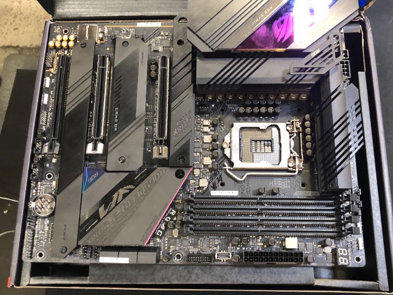 Photo 2 of ROG Strix Z590-E Gaming WiFi 6E LGA 1200(Intel® 11th/10th Gen) ATX Gaming Motherboard (PCIe 4.0, 14+2 Power Stages, DDR4 5333+, Dual Intel® 2.5 Gb LAN,Thunderbolt 4, 4xM.2/NVMe SSD and Aura RGB)---CPU PINS ARE BENT---
