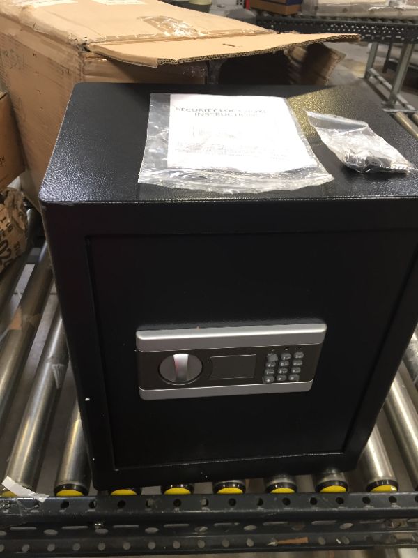 Photo 1 of 12 x 15 x 18 inch black safe with keys.