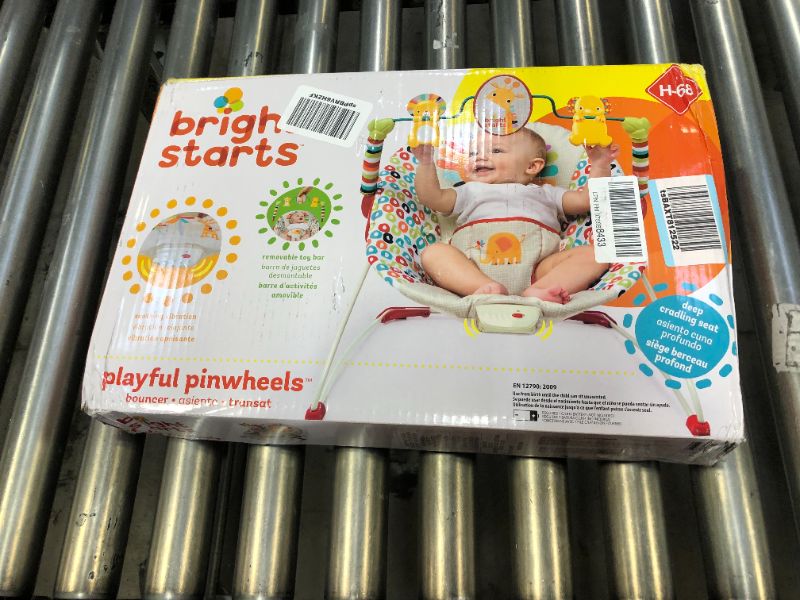 Photo 3 of Bright Starts Playful Pinwheels Portable Baby Bouncer with Vibrating Infant Seat and Toy Bar, 19.8x13.1x3.4 Inch, Age 0-6 Months---OPEN BOX---
