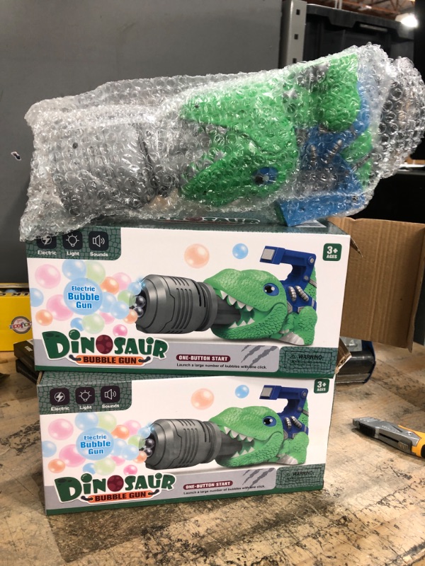 Photo 2 of Dinosaur Bubble Machine Bubble Gun Gifts for Boys Girls Bubble Toys for Kids Toddlers Bubble Blower with Music Green Bubble Maker Summer Birthday Gifts for Kids Ages 3-5,4-8 - 2 pack
