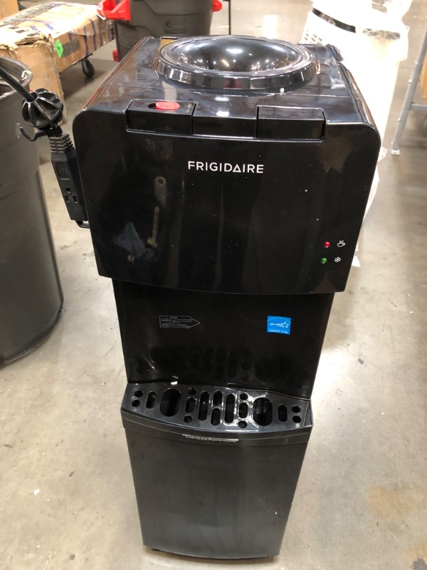 Photo 5 of (DAMAGE)Frigidaire Enclosed Hot and Cold Water Cooler/Dispenser (Black)
**MAKES LOUD NOISE, TURNS ON, LEAKS WATER**