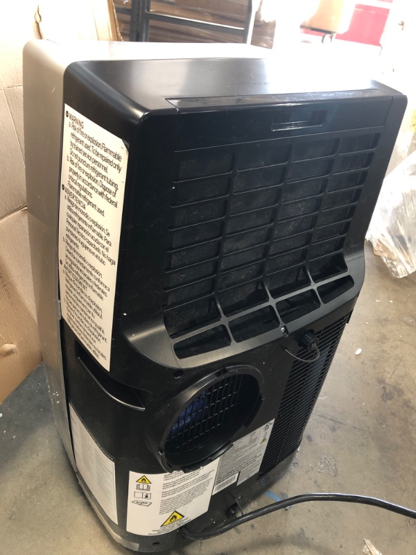Photo 1 of Honeywell Classic Portable Air Conditioner with Dehumidifier & Fan Cools Rooms Up To 500 Sq. Ft. w Drain Pan & Insulation Tape, MN1CFS8 (Black/Silver)
