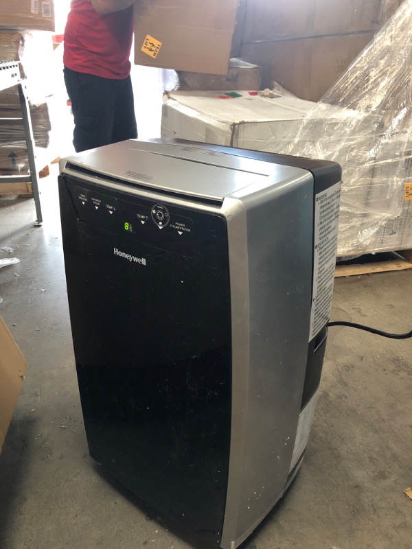 Photo 1 of Honeywell Classic Portable Air Conditioner with Dehumidifier & Fan Cools Rooms Up To 500 Sq. Ft. w Drain Pan & Insulation Tape, MN1CFS8 (Black/Silver)
