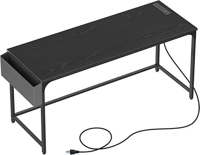 Photo 1 of Rolanstar Computer Desk with Power Outlet, 63” Home Office PC Desk with USB Ports Charging Station, Desktop Table with Side Storage Bag and Iron Hooks, Stable Metal Frame Workstation, Black
