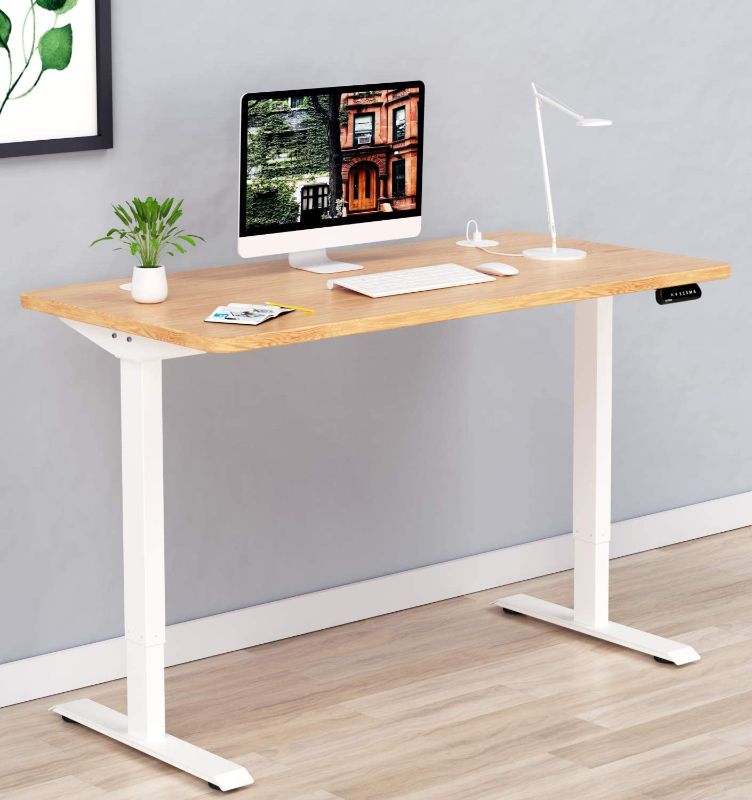 Photo 1 of SOLOS Electric Height Adjustable Standing Desk, 55 x 27 Inches Workstation with Desktop, Ergonomic Memory Controller Sit Stand up Desk Home Office Table Standing Desk(White Frame + 55” Wood Top)
