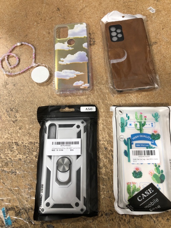 Photo 1 of BUNDLE OF: GALAXY A52 BROWN WALLET CASE, GALAXY S10 CACTUS CASE, GALAXY A50 SILVER CASE, MOTO G STYLUS CLOUD CASE