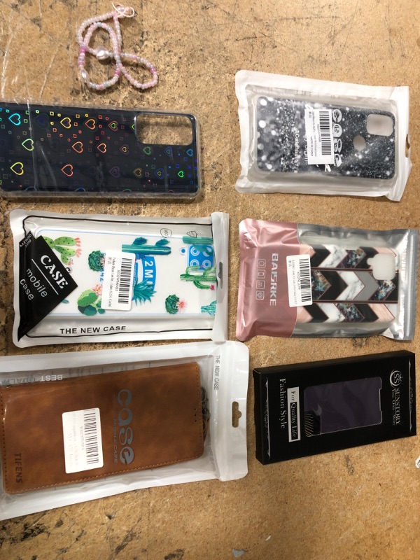 Photo 1 of BUNDLE OF: PURPLE GALAXY A33, GALAXY A12, CACTUS GALAXY A42, BROWN WALLET CASE GALAZY A52, HEART MOTO EDGE