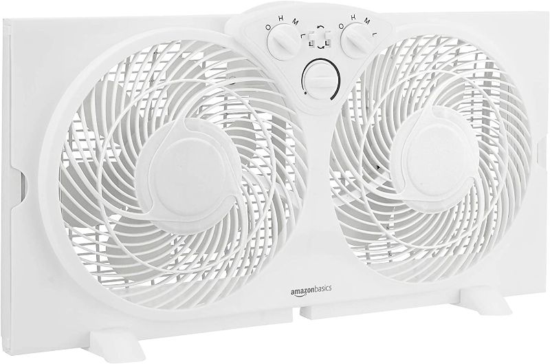 Photo 1 of Amazon Basics Window Fan with Manual Controls, Twin 9-Inch Reversible Airflow Blades
