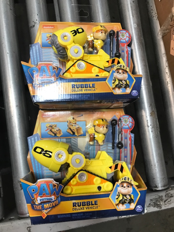 Photo 2 of 2 PACK: Paw Patrol, Rubble S Deluxe Movie Transforming Toy Car with Collectible Action Figure, Kids Toys for Ages 3 and up Yellow
