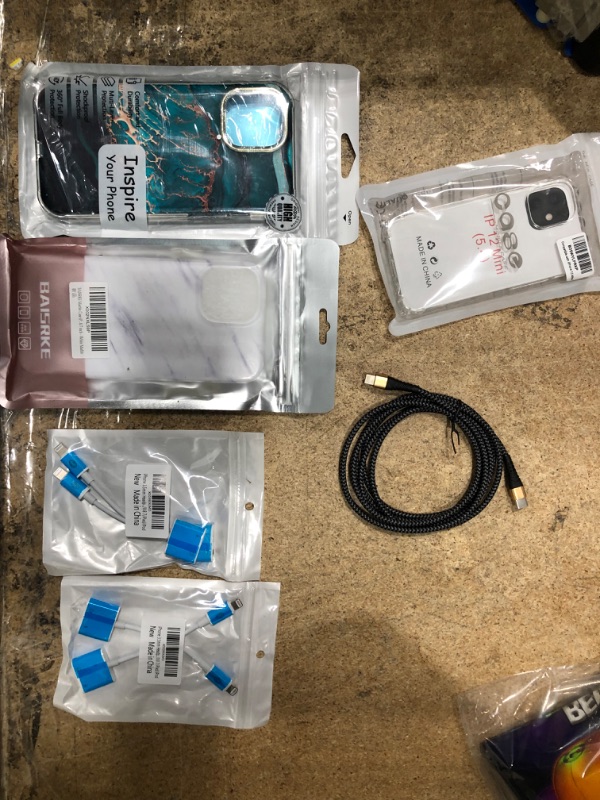 Photo 1 of Consumer Electronic Bundle. 3 Phone Case and 4 iPhone Headphone Jacks.