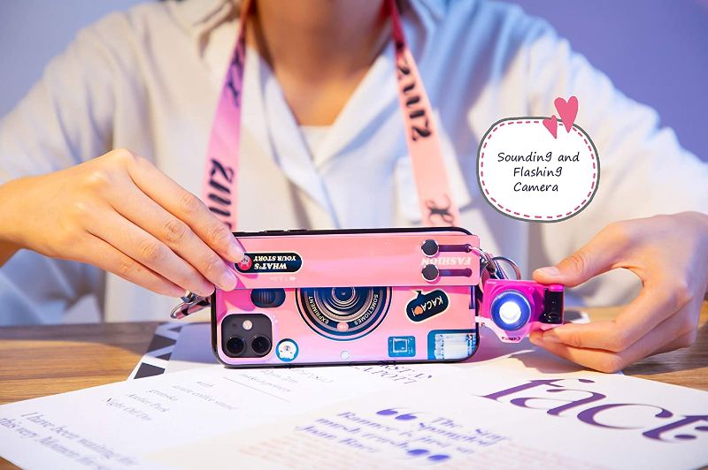 Photo 1 of Compatible with iPhone 12 Case with Phone Lanyard, 6.1 inch Cute Camera Design, Glitter Luxury Soft Silicone Phone Case for iPhone 12 with Wrist Strap (iPhone 12, Pink).
