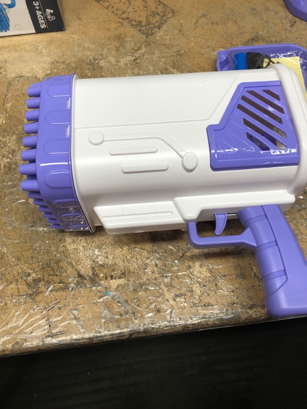 Photo 1 of CRONDA 60-Hole Rocket Launcher Shape Bubble Maker, Rocket Boom Bubble Gun, Bubble Machine for TIK Tok, Huge Bubble Maker, Bubble Machine for Kids and Toddlers (Purple)
