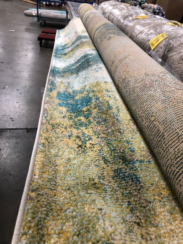 Photo 1 of 7'6x9'6 blue/green pattern rug
