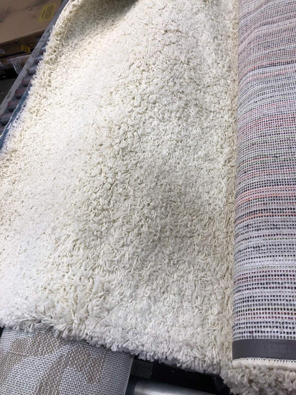 Photo 3 of **used - needs cleaning** 
white pure ivory 5 x 8 rug 