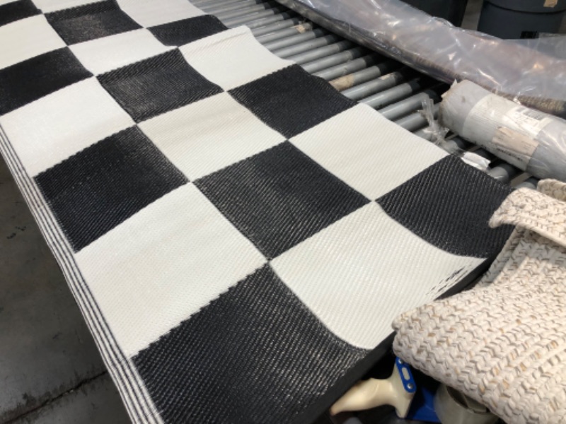 Photo 4 of **USED - NEEDS CLEANING**
7FT X 11 FT CHECKERED RUG 