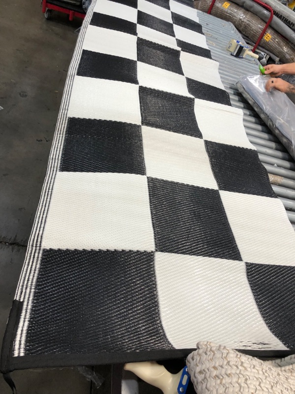 Photo 1 of **USED - NEEDS CLEANING**
7FT X 11 FT CHECKERED RUG 